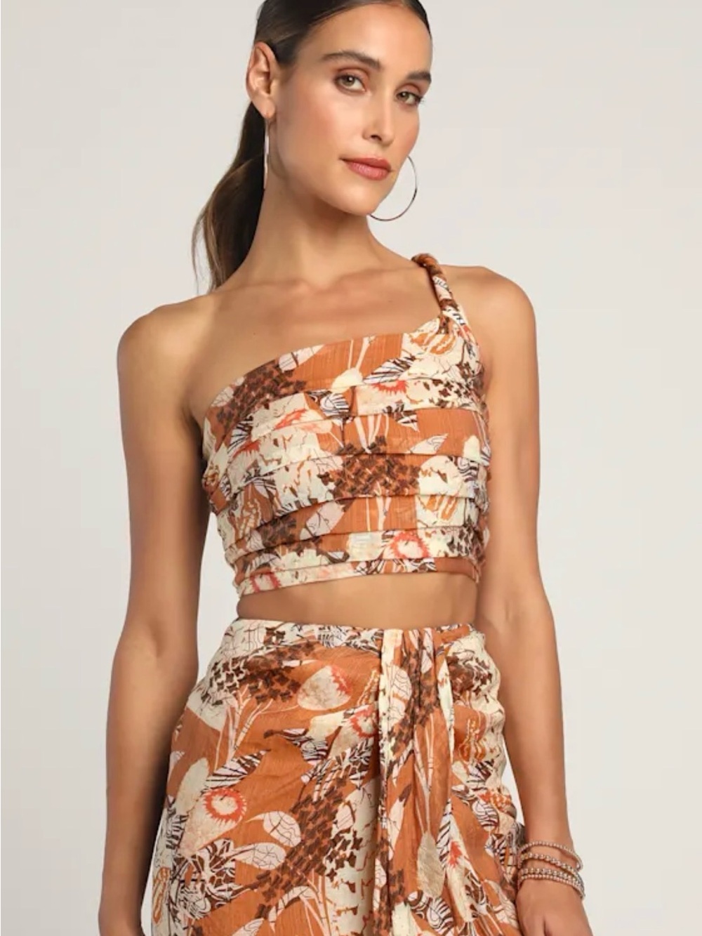 Something Wild Brown Multi Print Pleated One-Shoulder Crop Top
Lulus